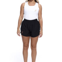 Blonde Female wearing White vest black shorts standing in front of a white background