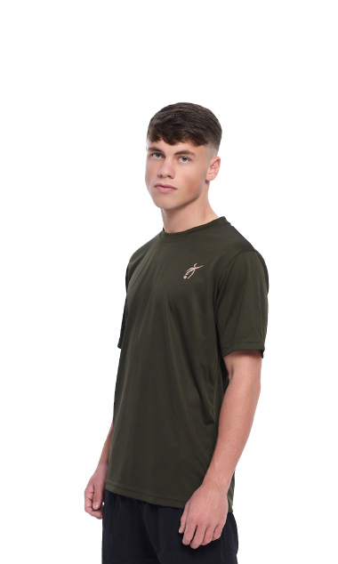 Male wearing green training top standing in front of a white background