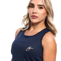 Blonde Female wearing Navy blue vest black shorts standing in front of a white background