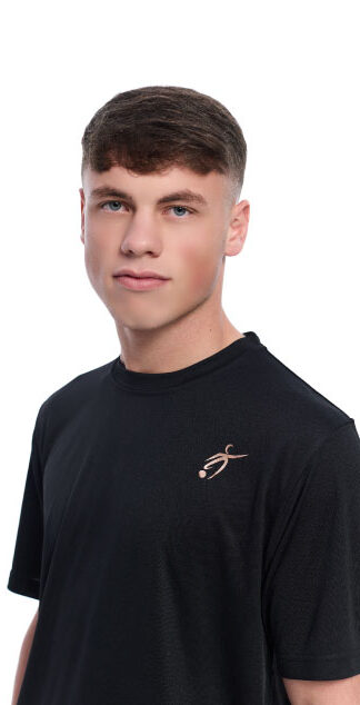 Close up of Male wearing black training top standing in front of a white background