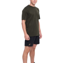 Male wearing green training top standing in front of a white background