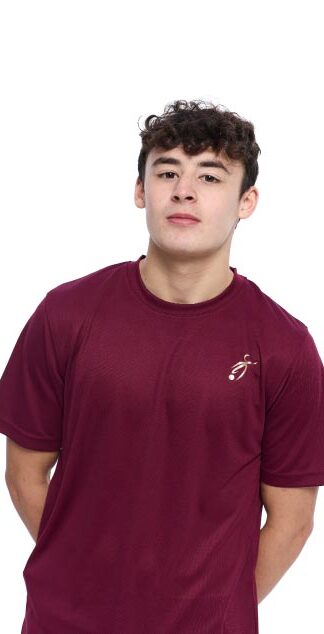 Male wearing Burgandy training top standing in front of a white background